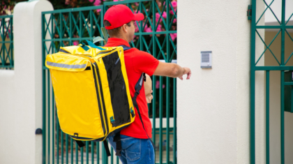 courier-uniform-with-isothermal-food-backpack-package-ringing-doorbell-shipping-delivery-service-concept