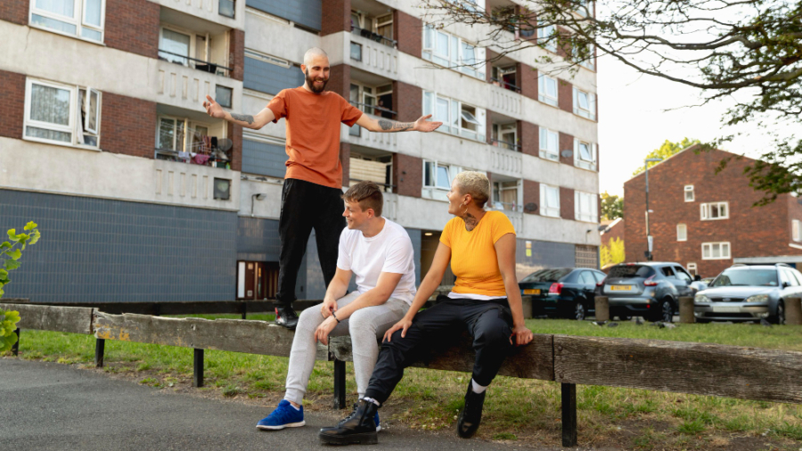 full-shot-friends-sitting-together-suburbs